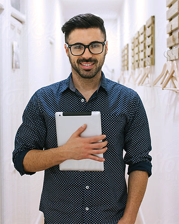 A Central Piedmont student holding a tablet