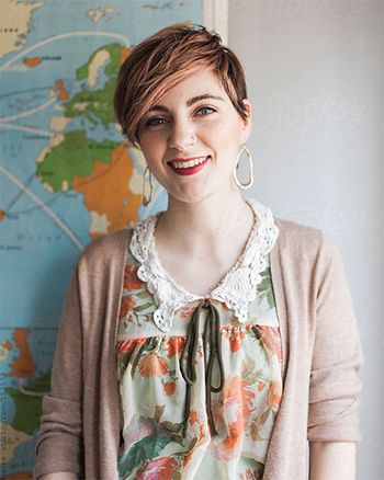 A Central Piedmont student with a map in the background