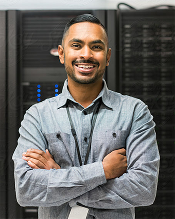 A Central Piedmont student standing in a server room