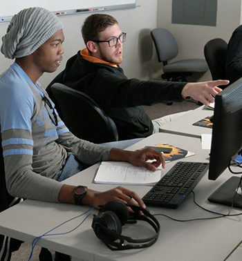 Two Central Piedmont students working on a computer