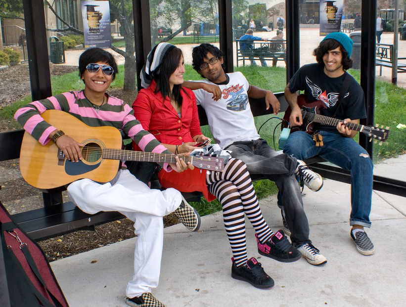 Four Central Piedmont students, two are holding guitars