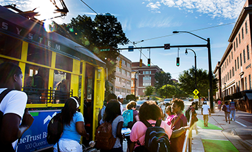 A group of student boarding the light rail