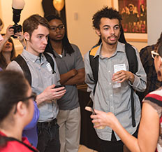 A group of Central Piedmont students talking together at an event