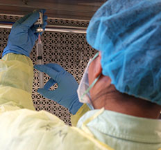 A Central Piedmont student in protective gear in a lab