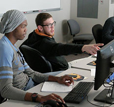 Two Central Piedmont students working together on a computer