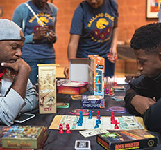 A group of Central Piedmont students playing board games