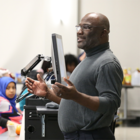 A Central Piedmont instructor at the podium in front of a class