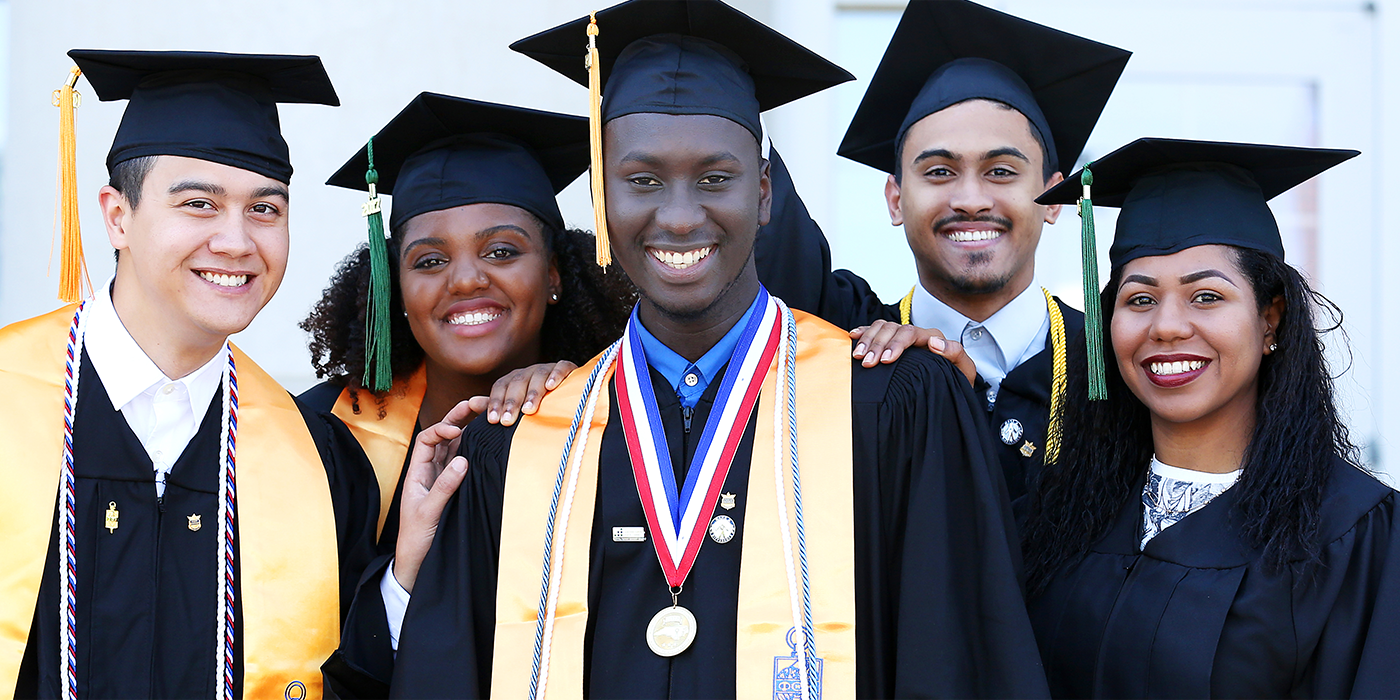 group of graduates in their graduation cap and gowns and regalia