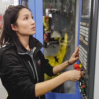 An engineering student working on equipment