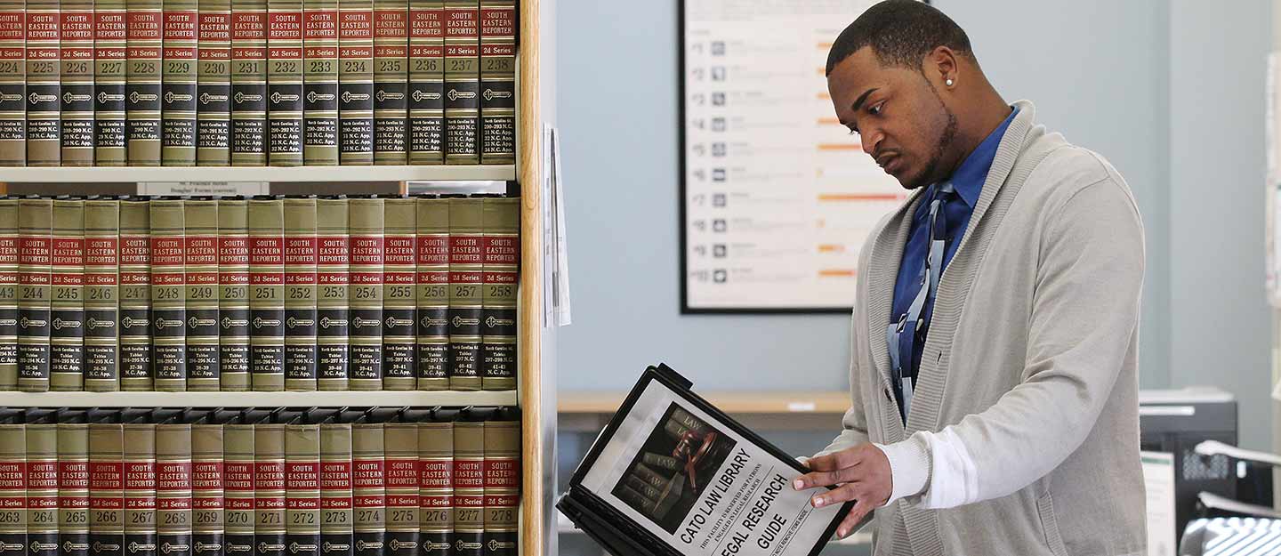 Man researching in law library