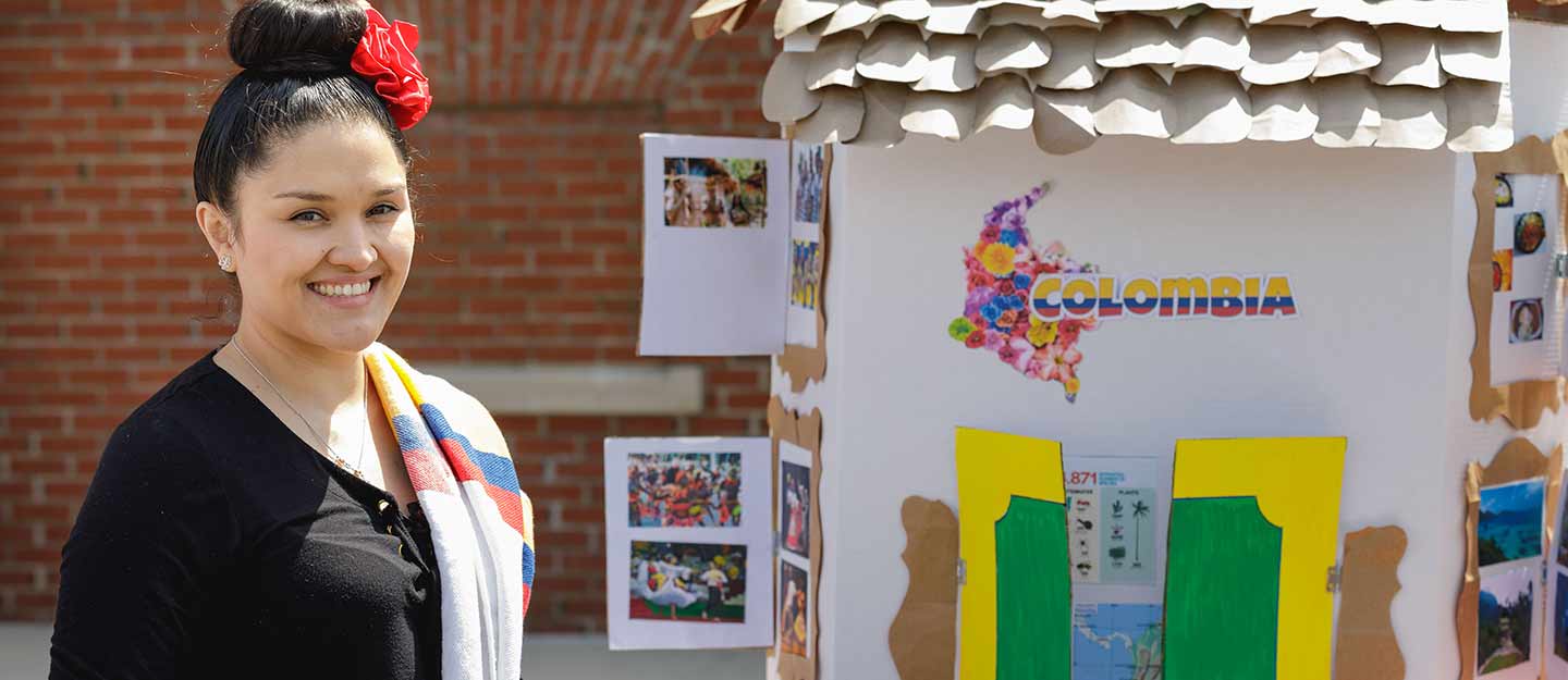 Student with a display of an exhibit of Colombia