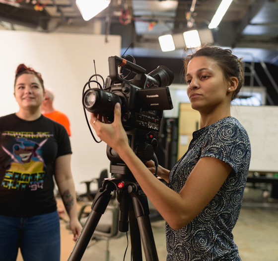 production assistant working with camera