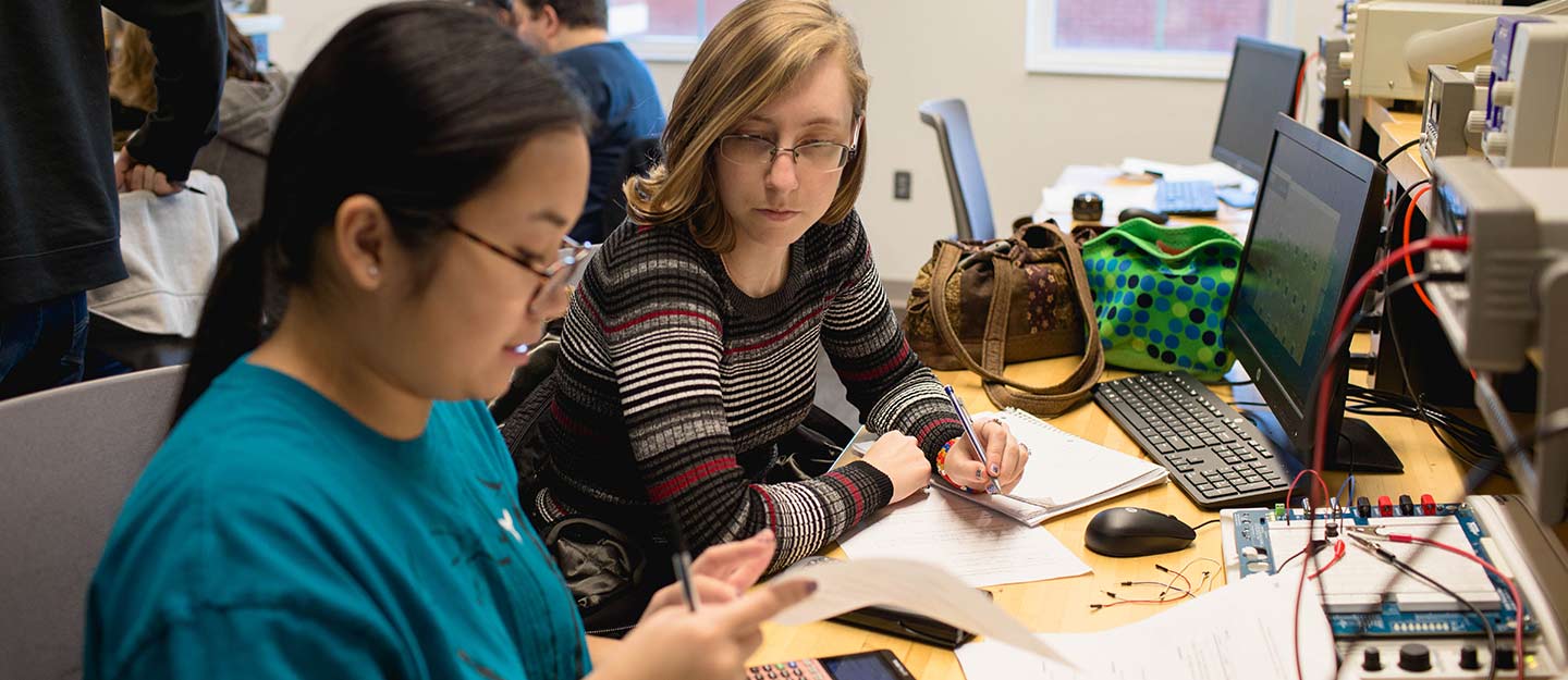 Students discussing electrical Engineering 