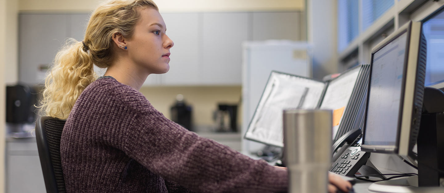 woman researching on a computer