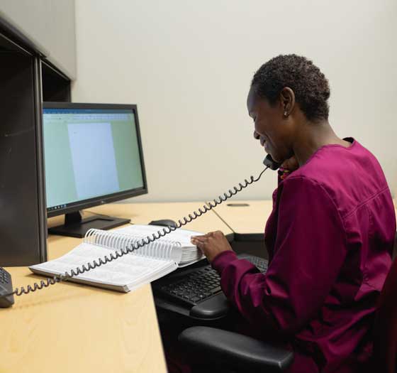 Woman on phone while looking up information