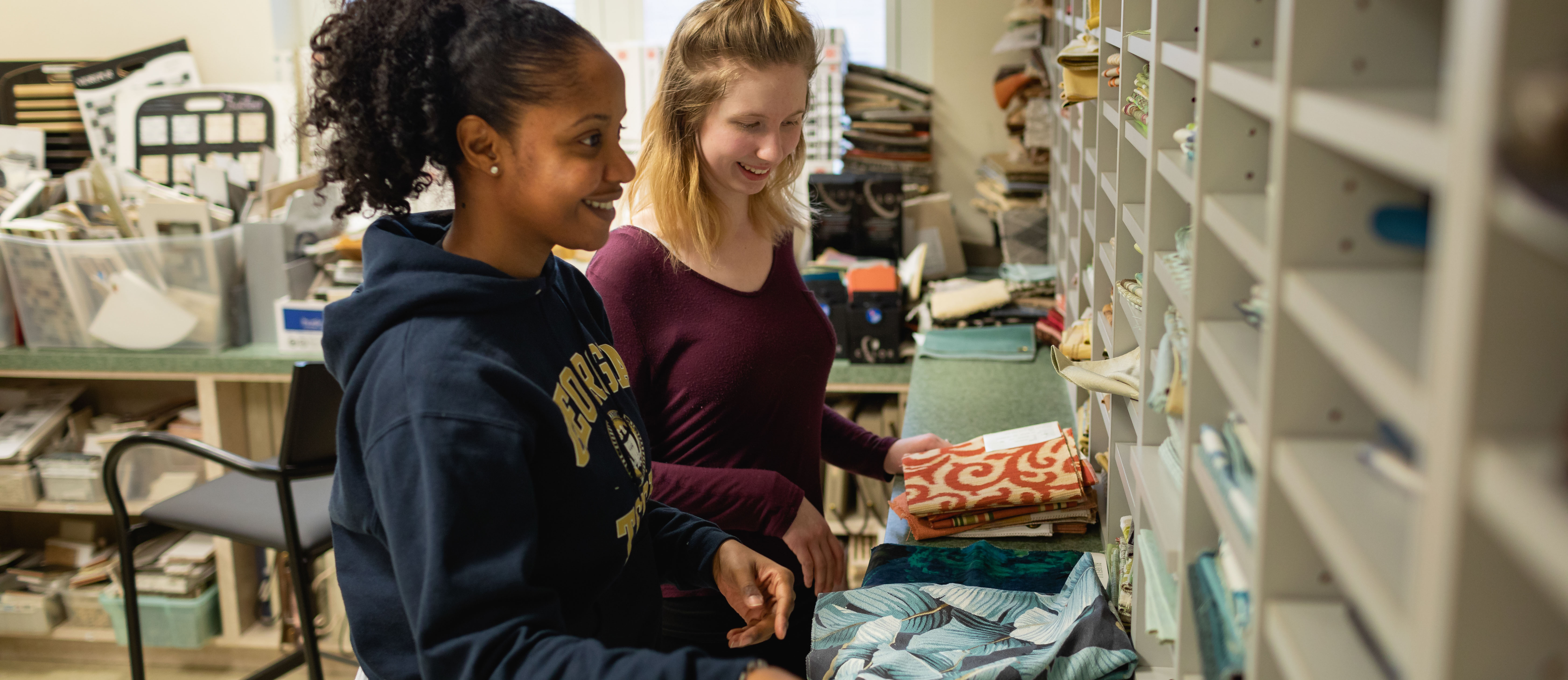 interior design students looking at fabric