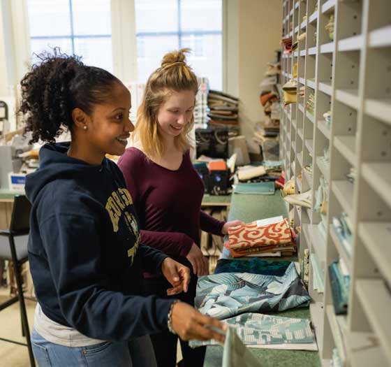 interior design students looking at fabric