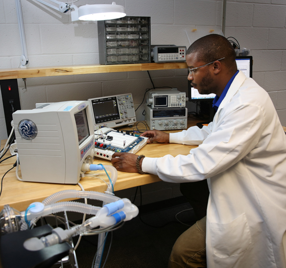 biomedical equipment student looking at tools