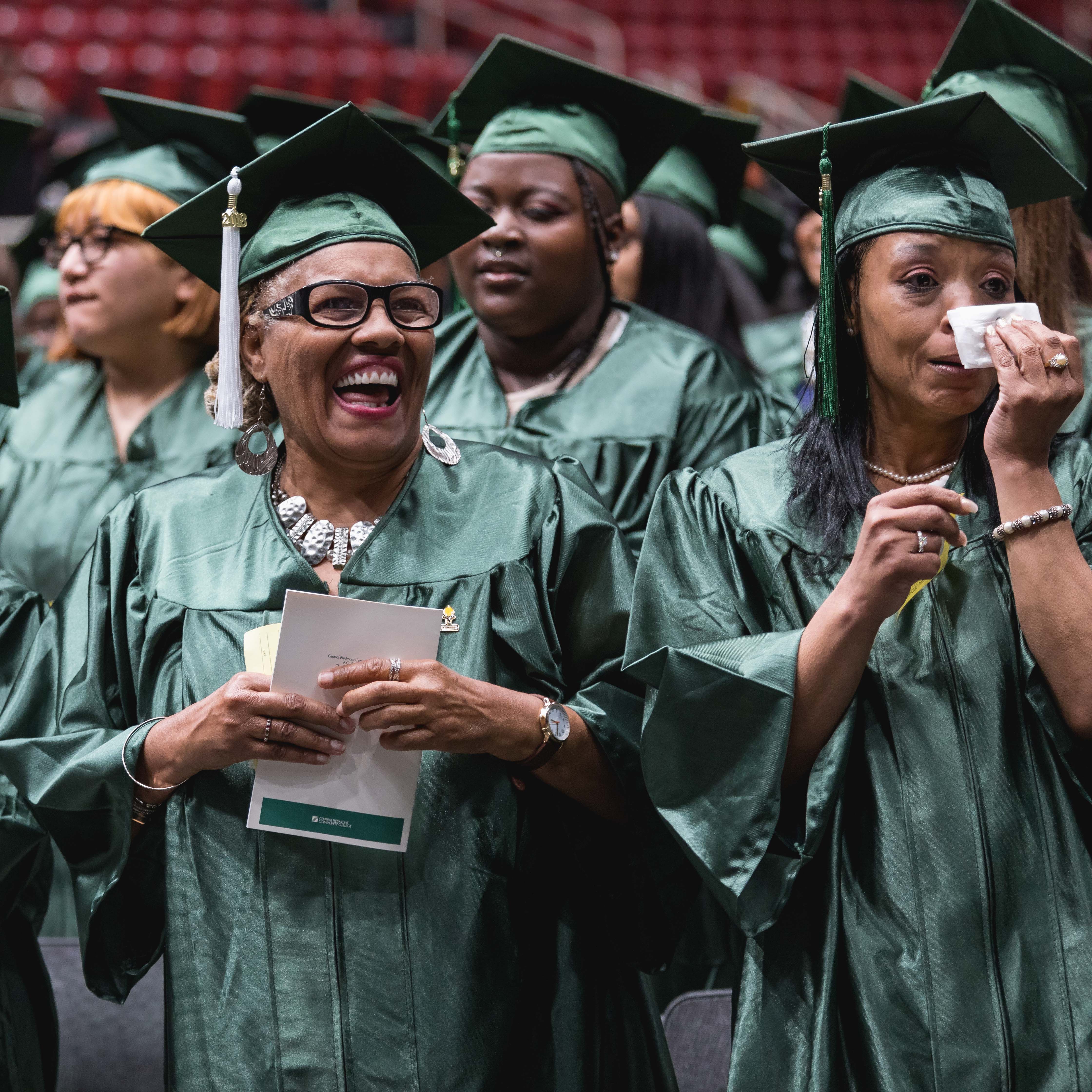 happy college and career readiness graduates at graduation