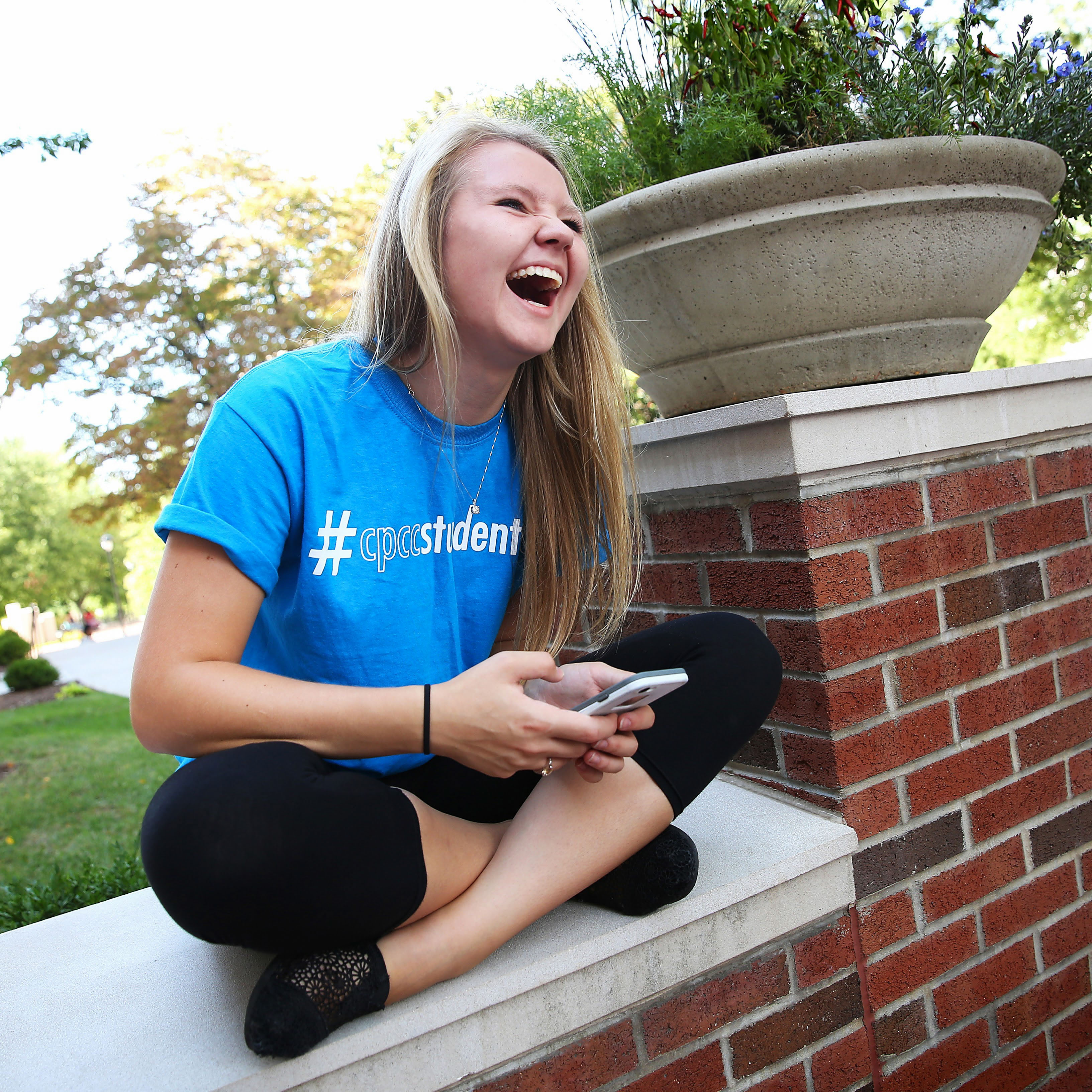 student laughing on campus