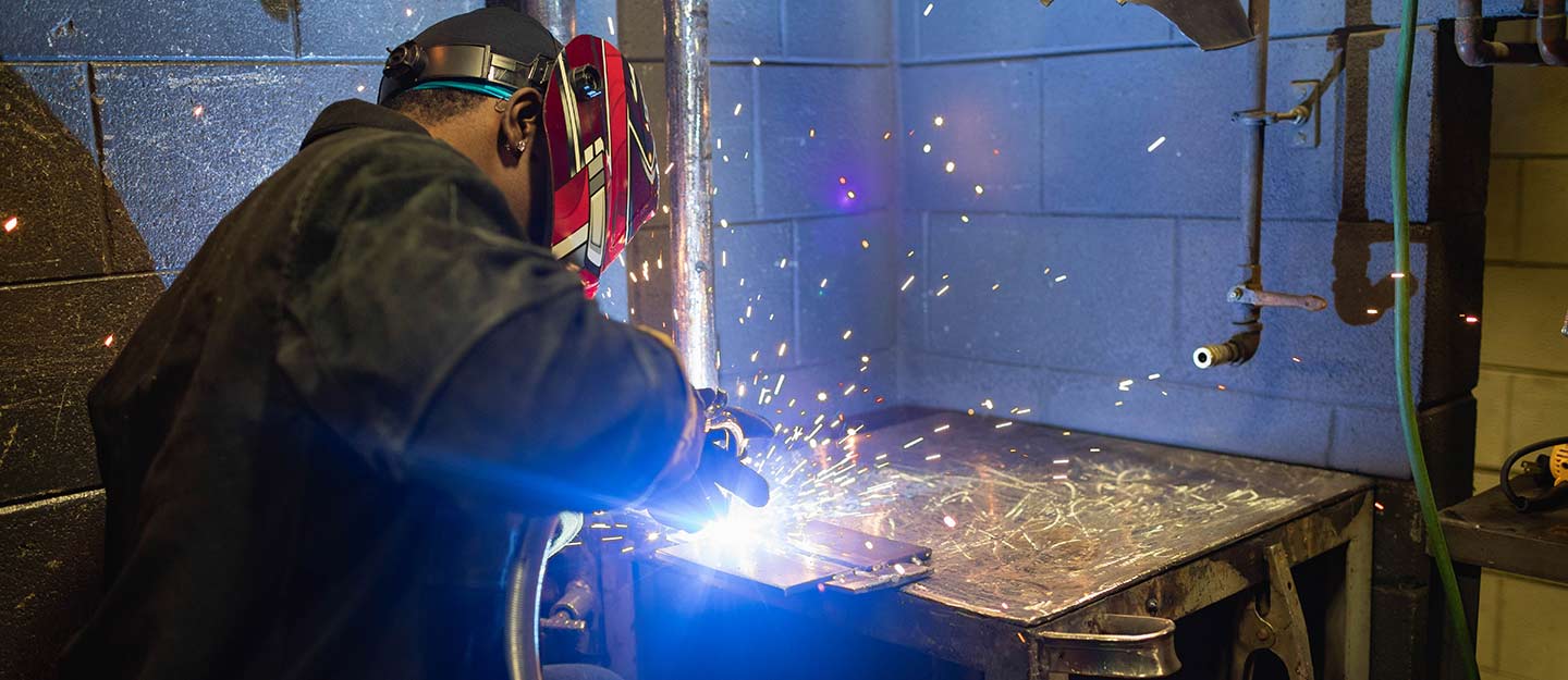 Aaron A. welding with a lot of sparks