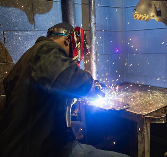 Aaron A. welding with a lot of sparks