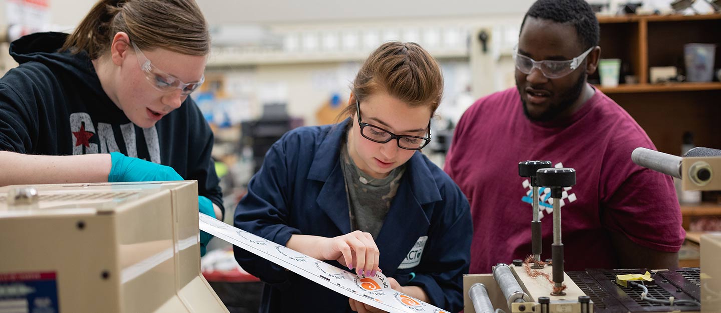 graphic arts and imaging technology students checking the quality of their vinyl stickers