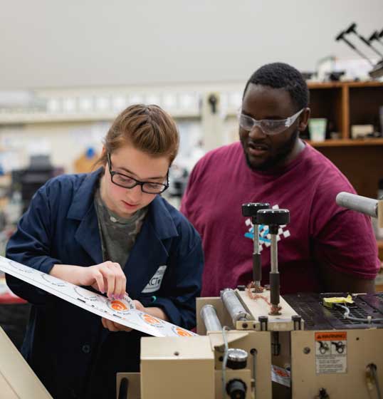 Graphic arts students checking their work