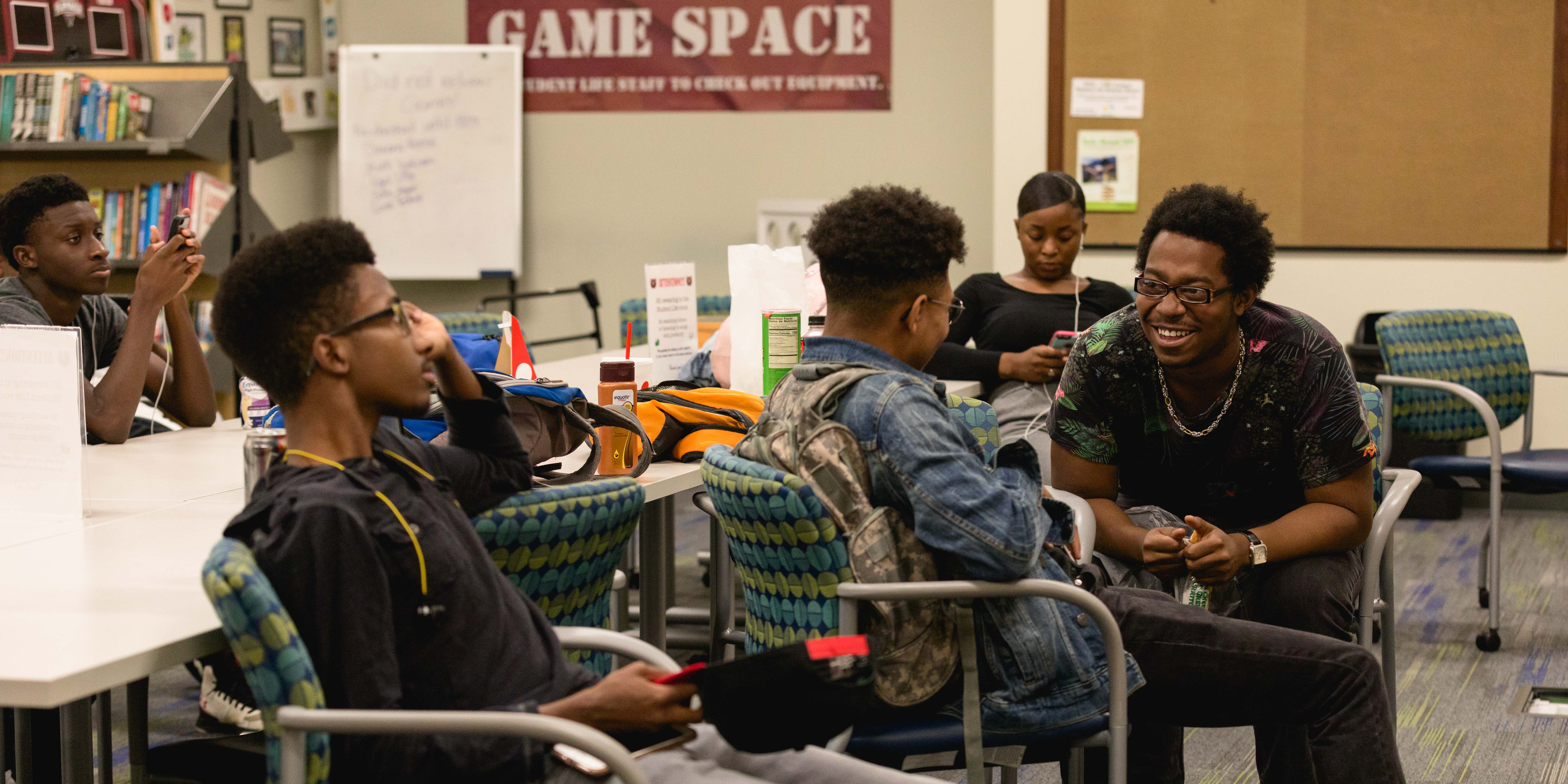 students chatting in room