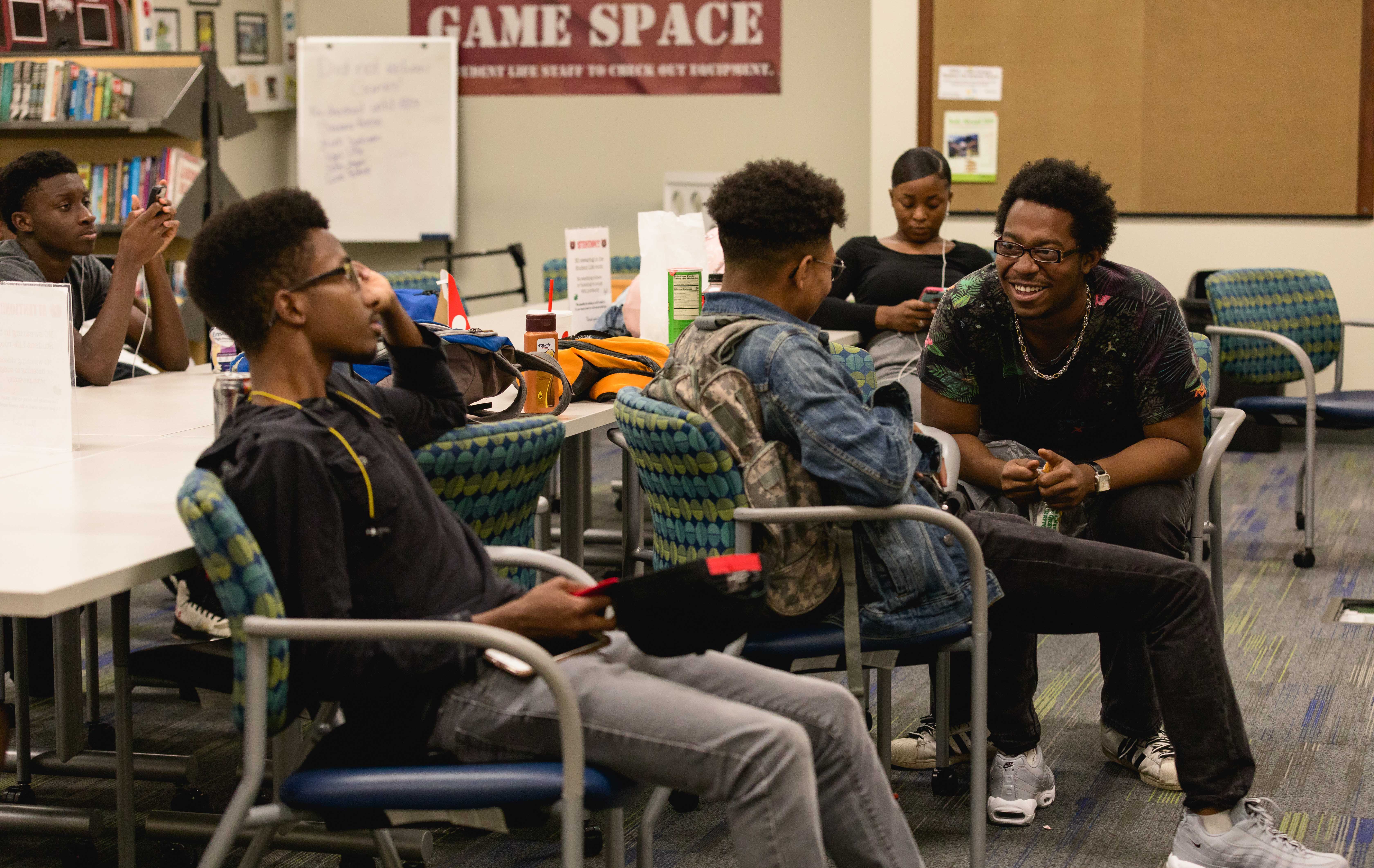 students chatting in room