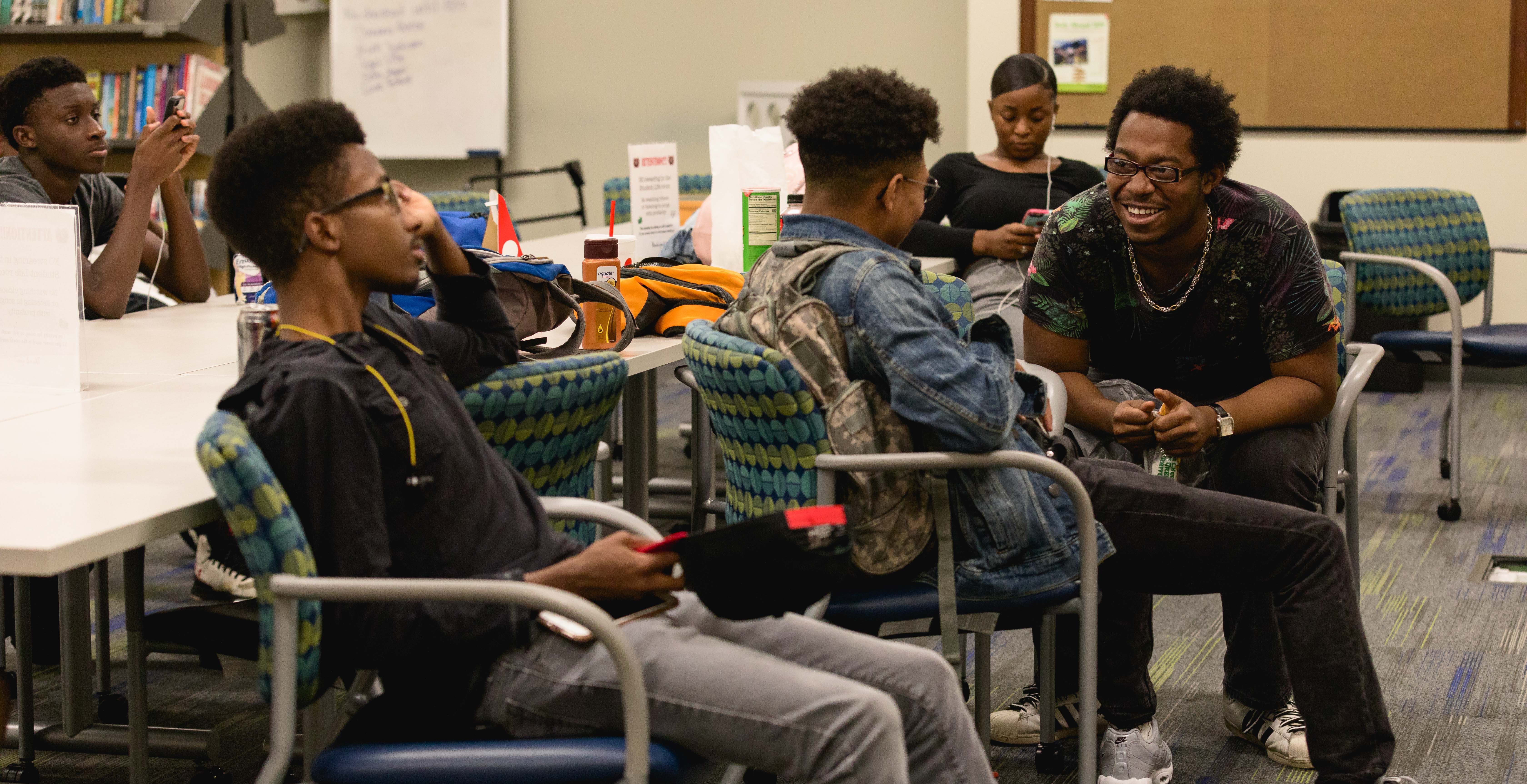 students chatting in room