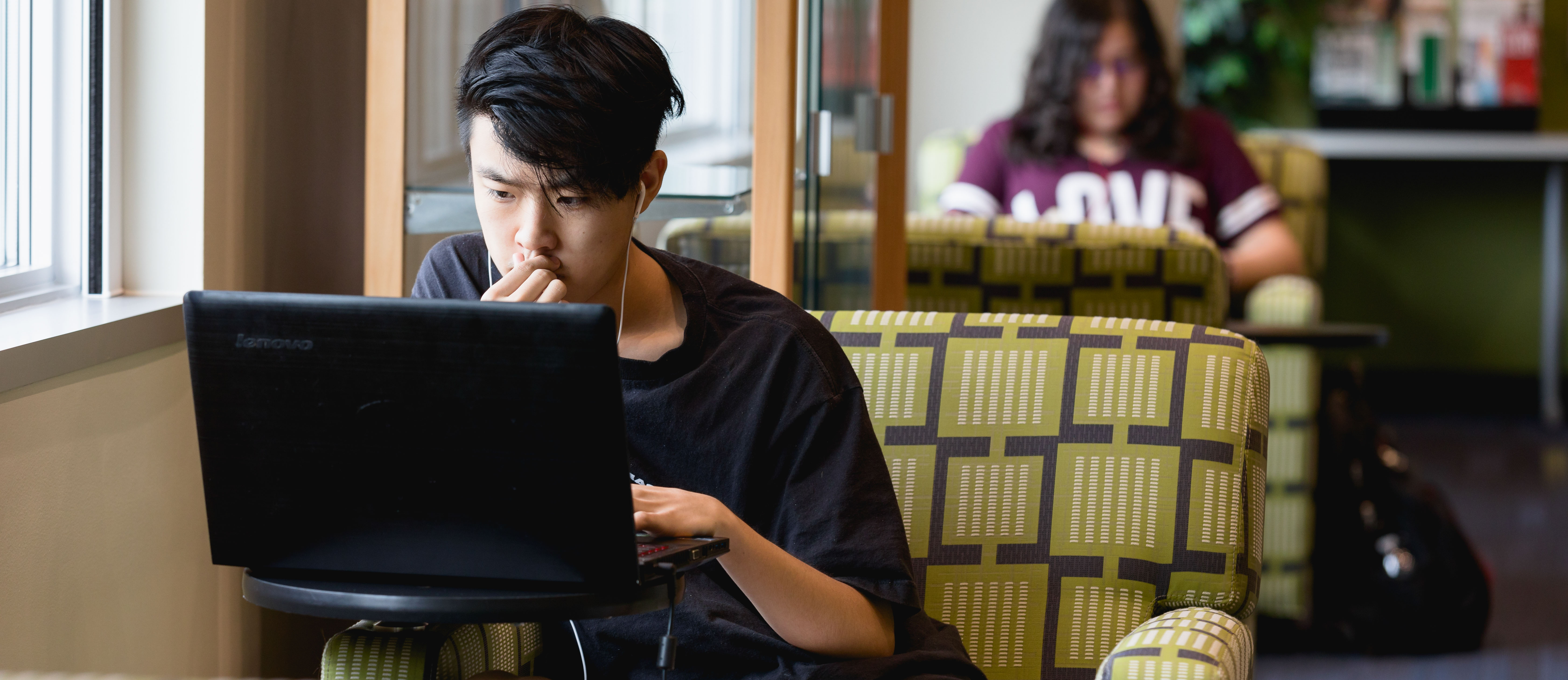 student working on laptop