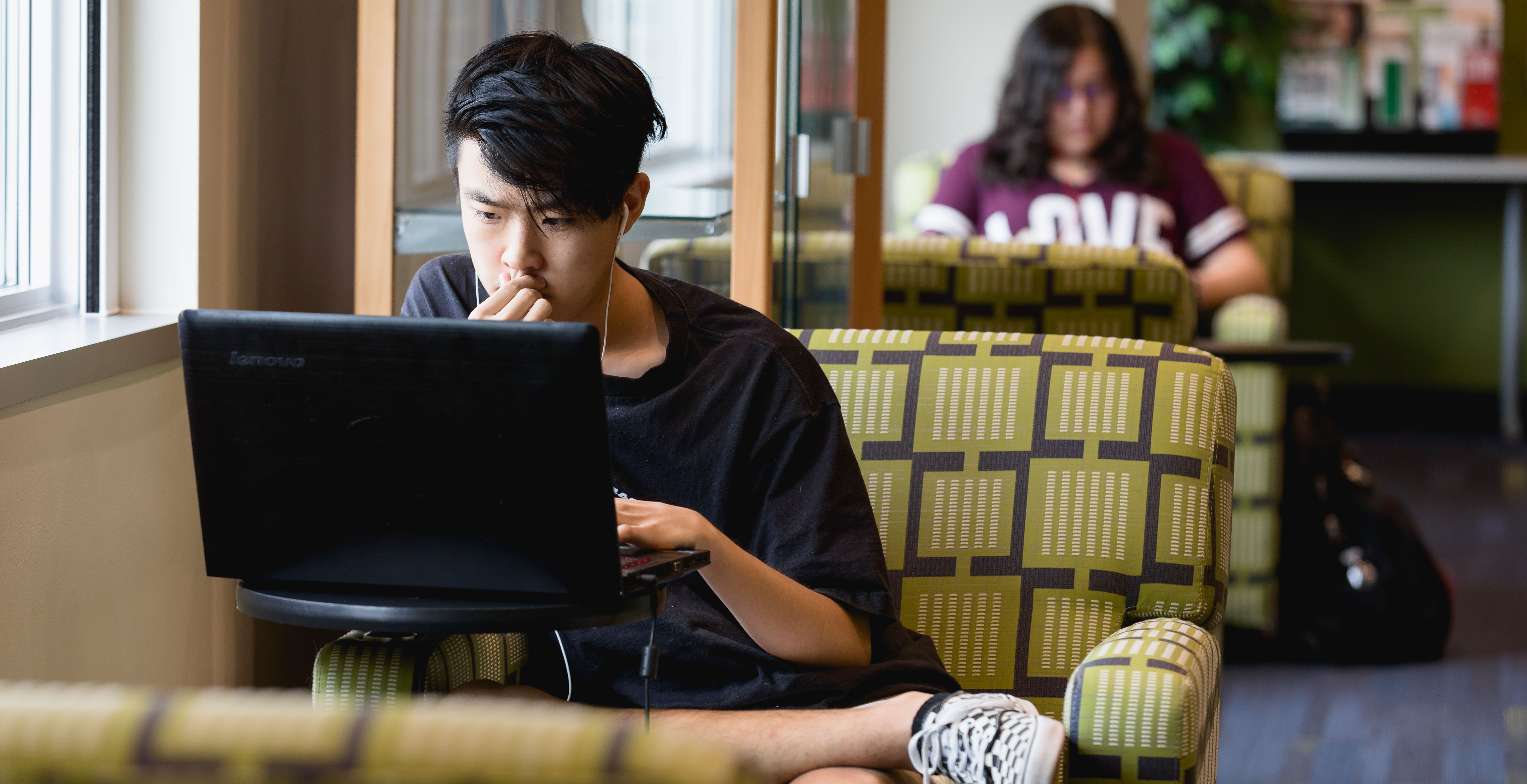 student working on laptop