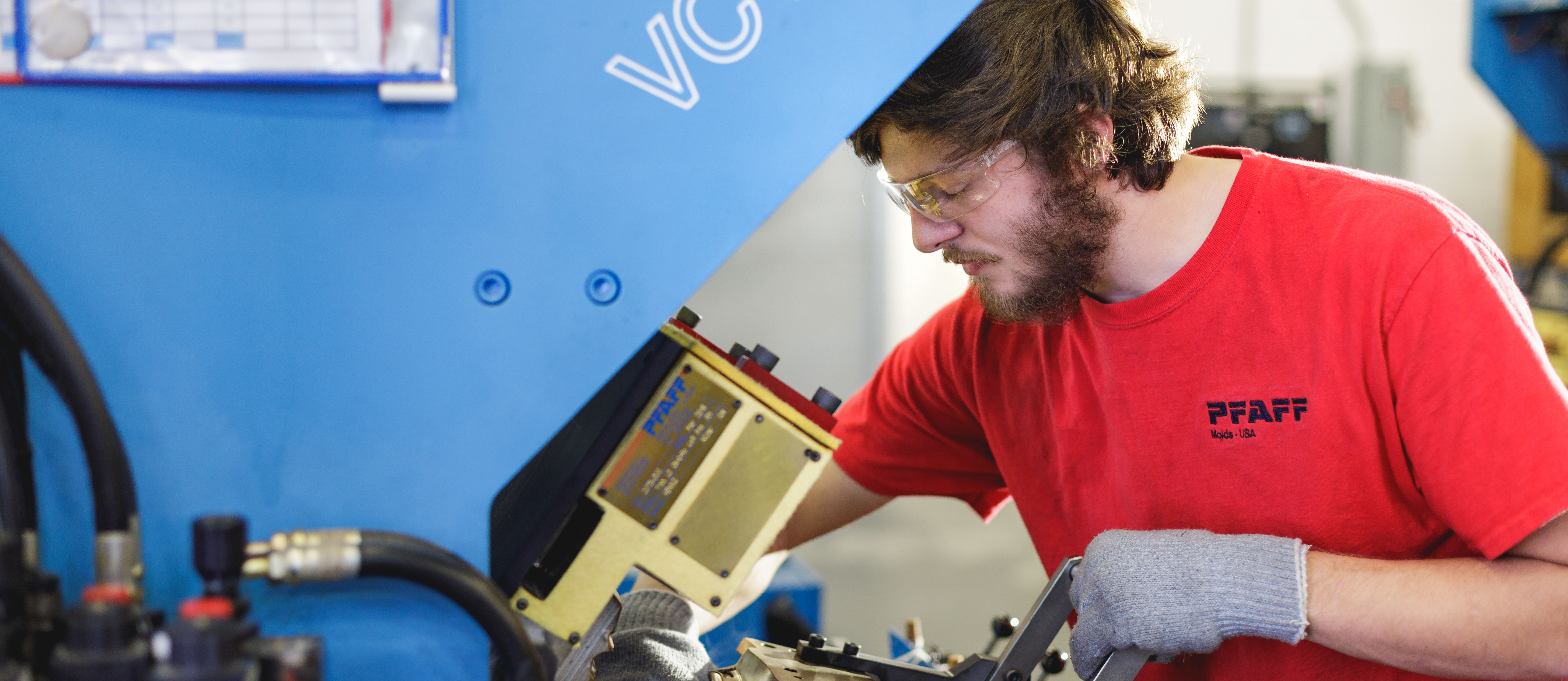 student getting on the job experience using a machine