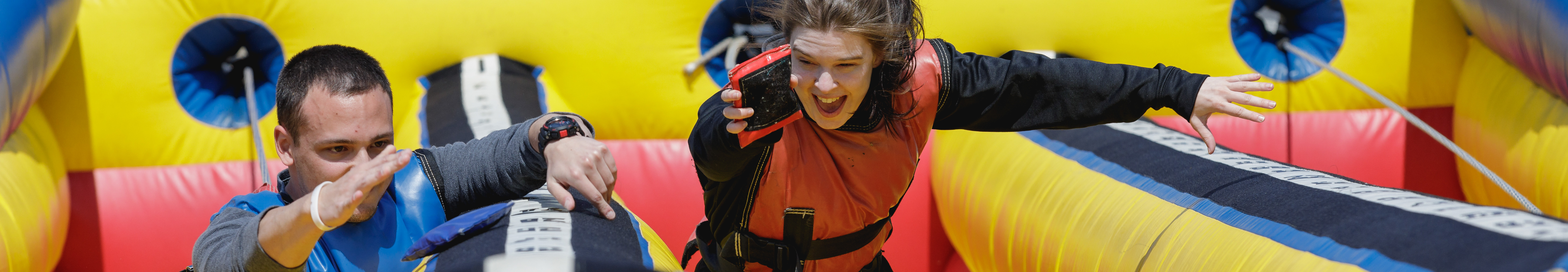 students racing on blow up track