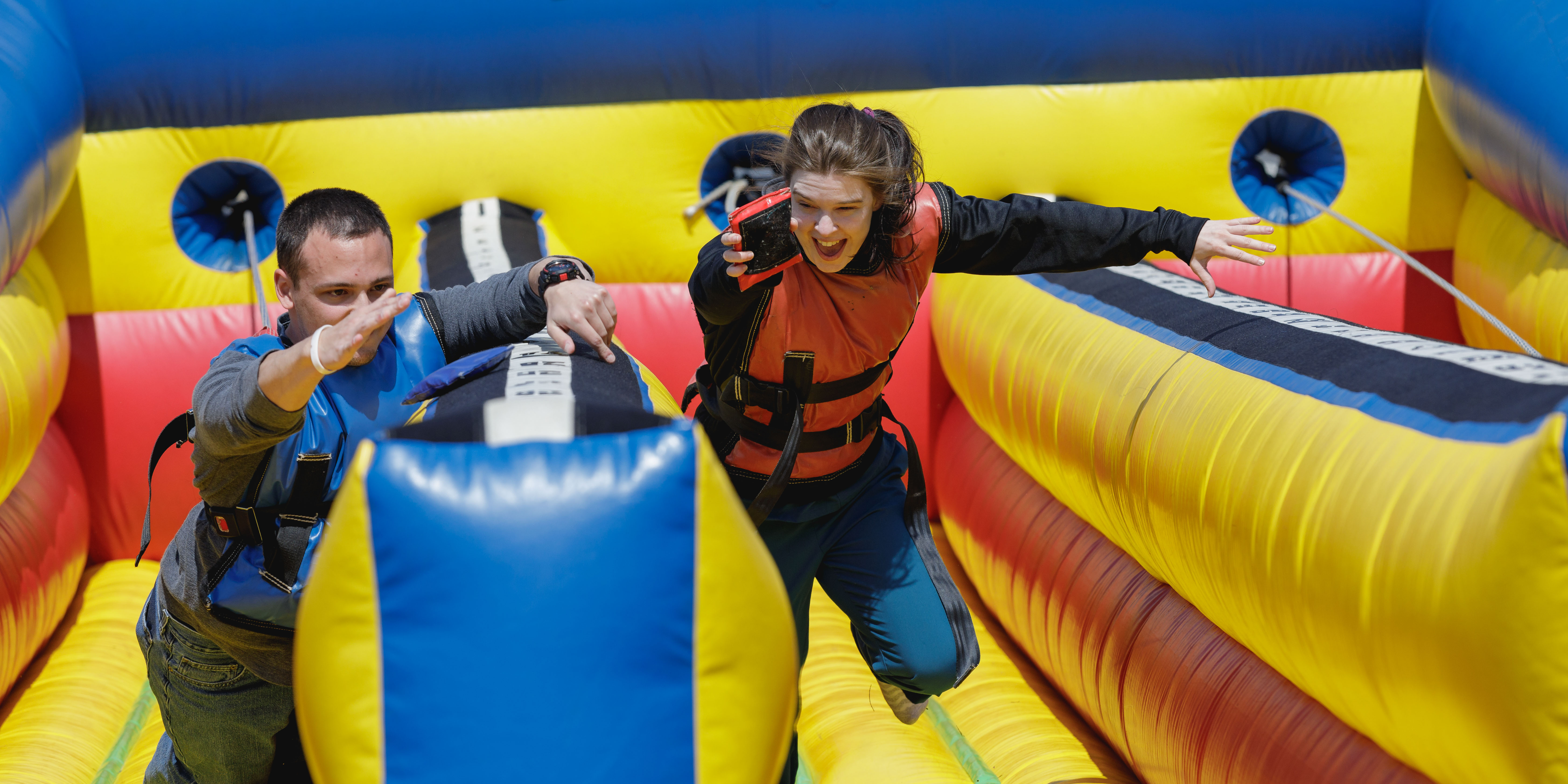 students racing on blow up track