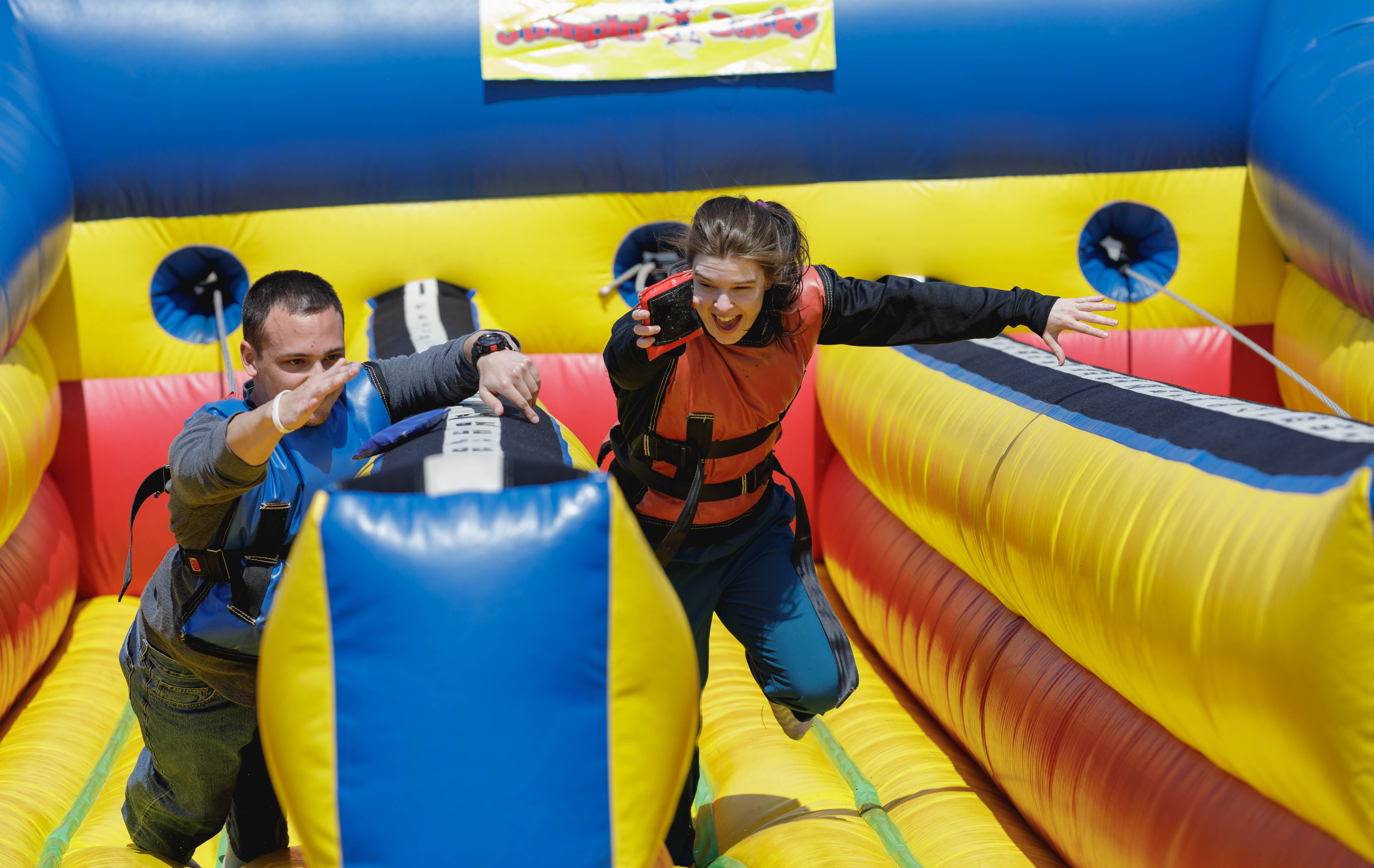 students racing on blow up track