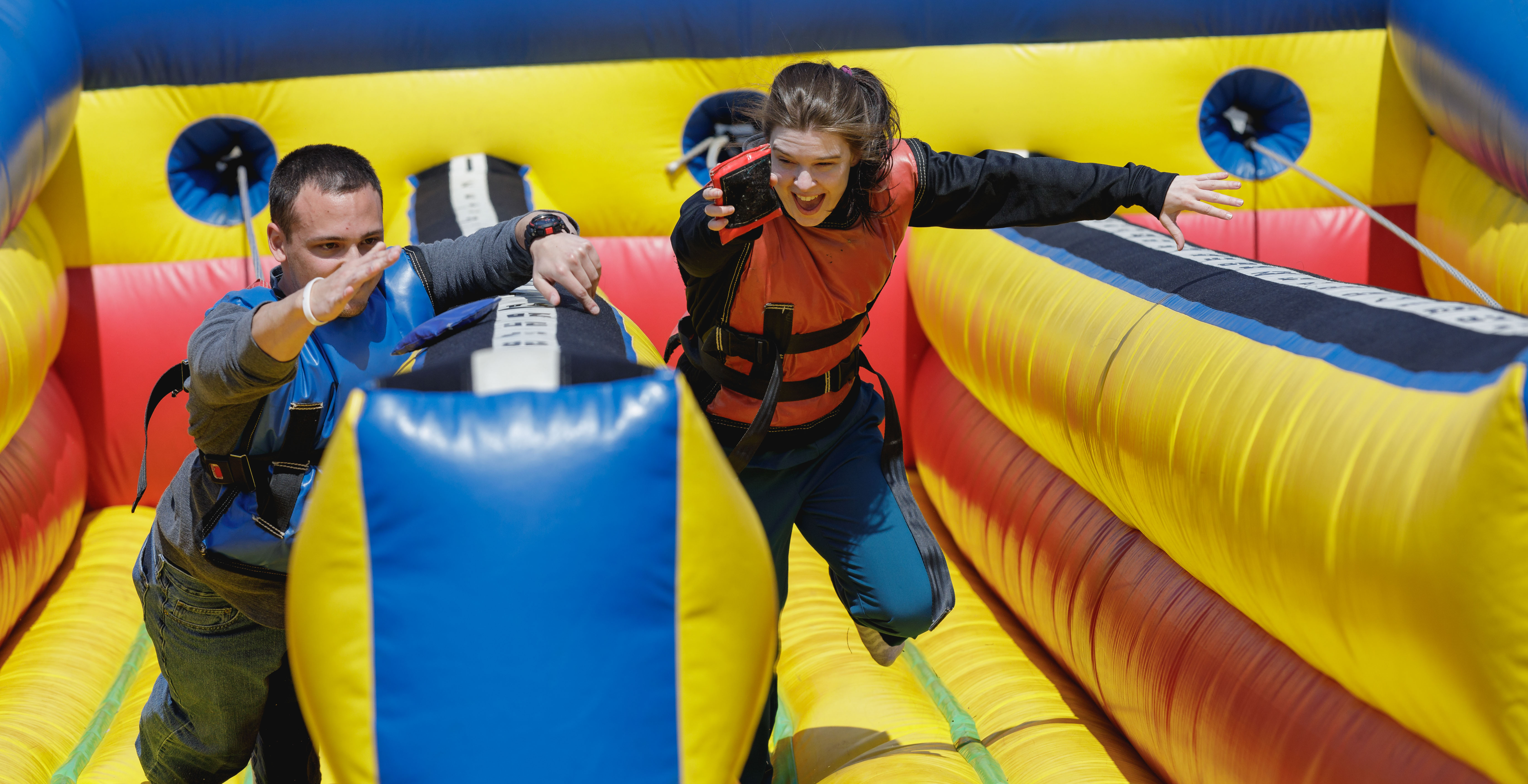 students racing on blow up track