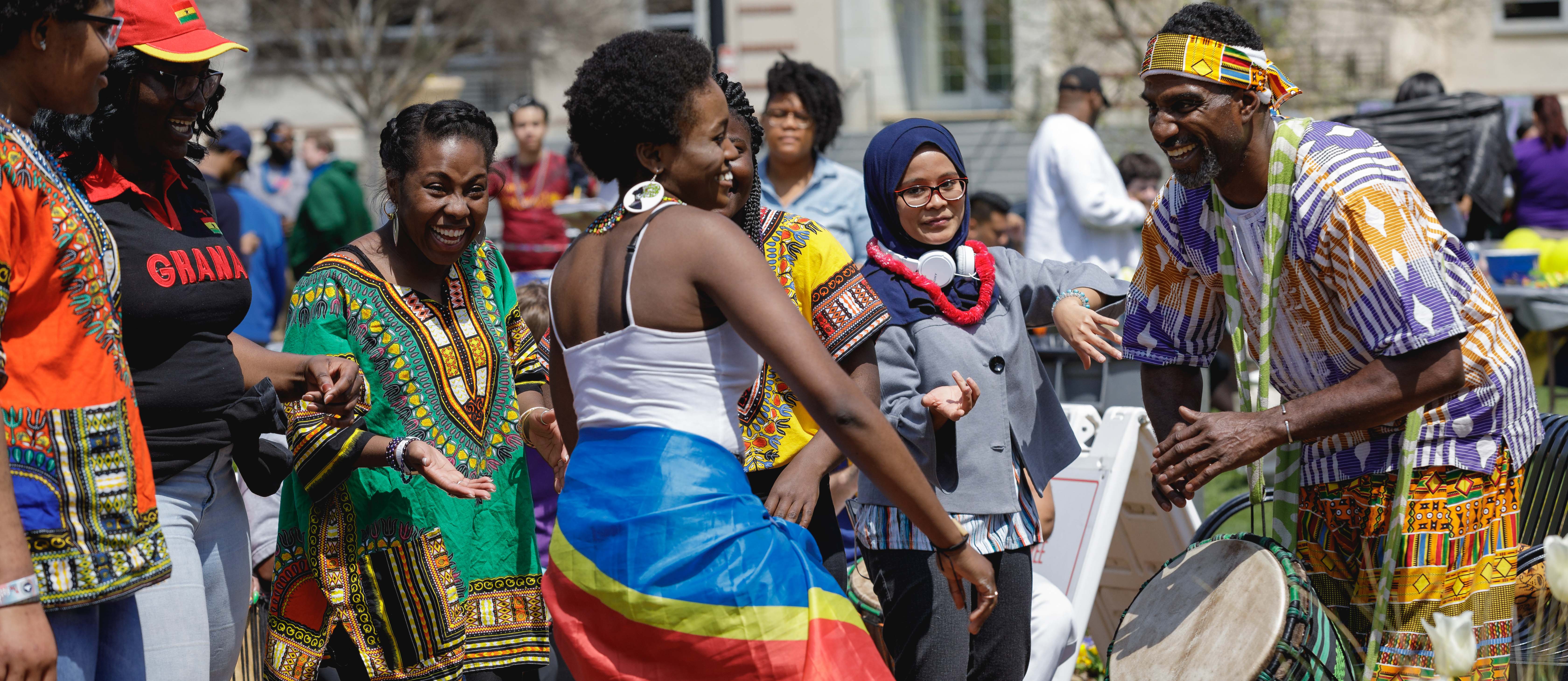 students dancing to drums at festival