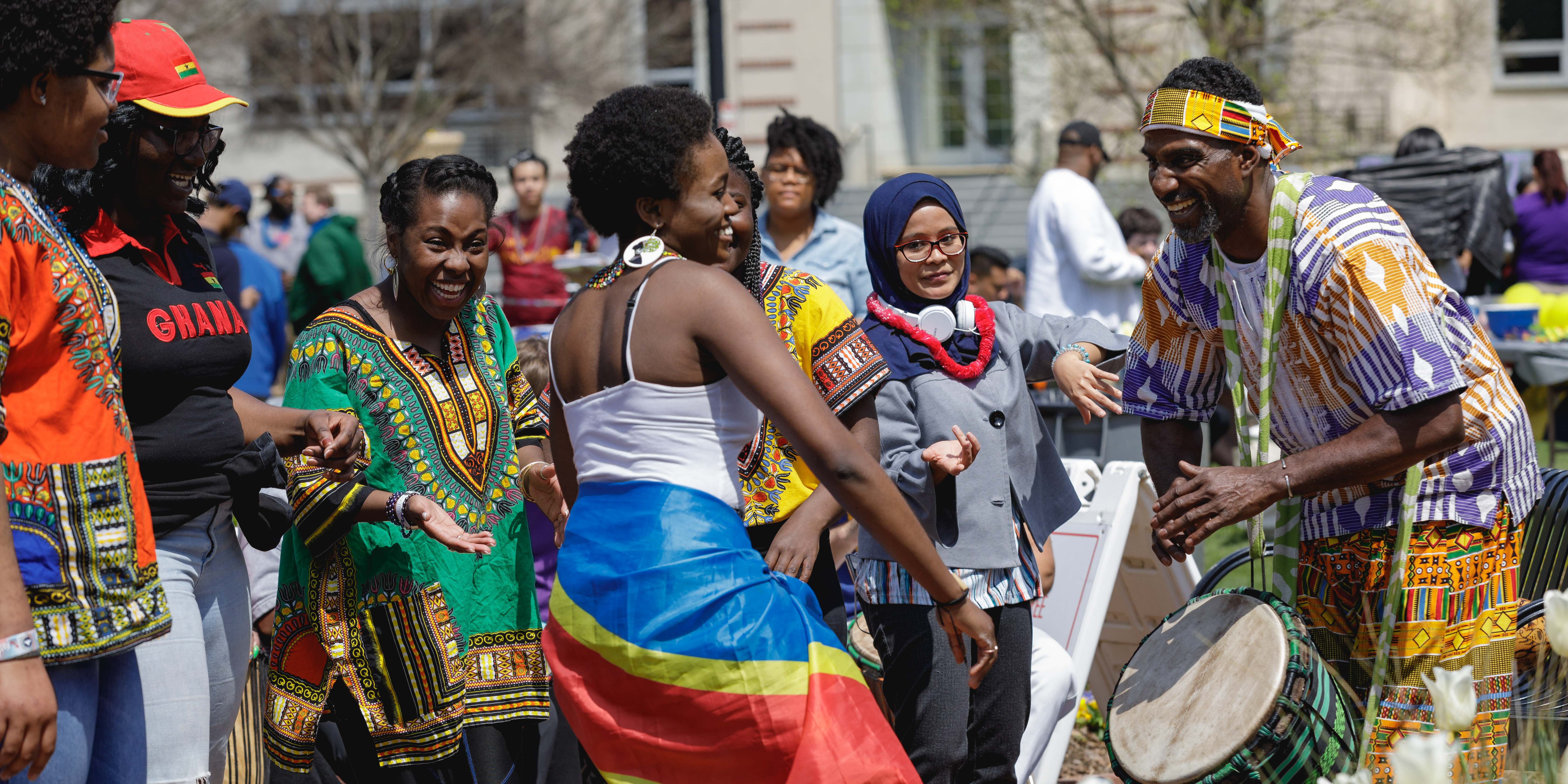 students dancing to drums at festival