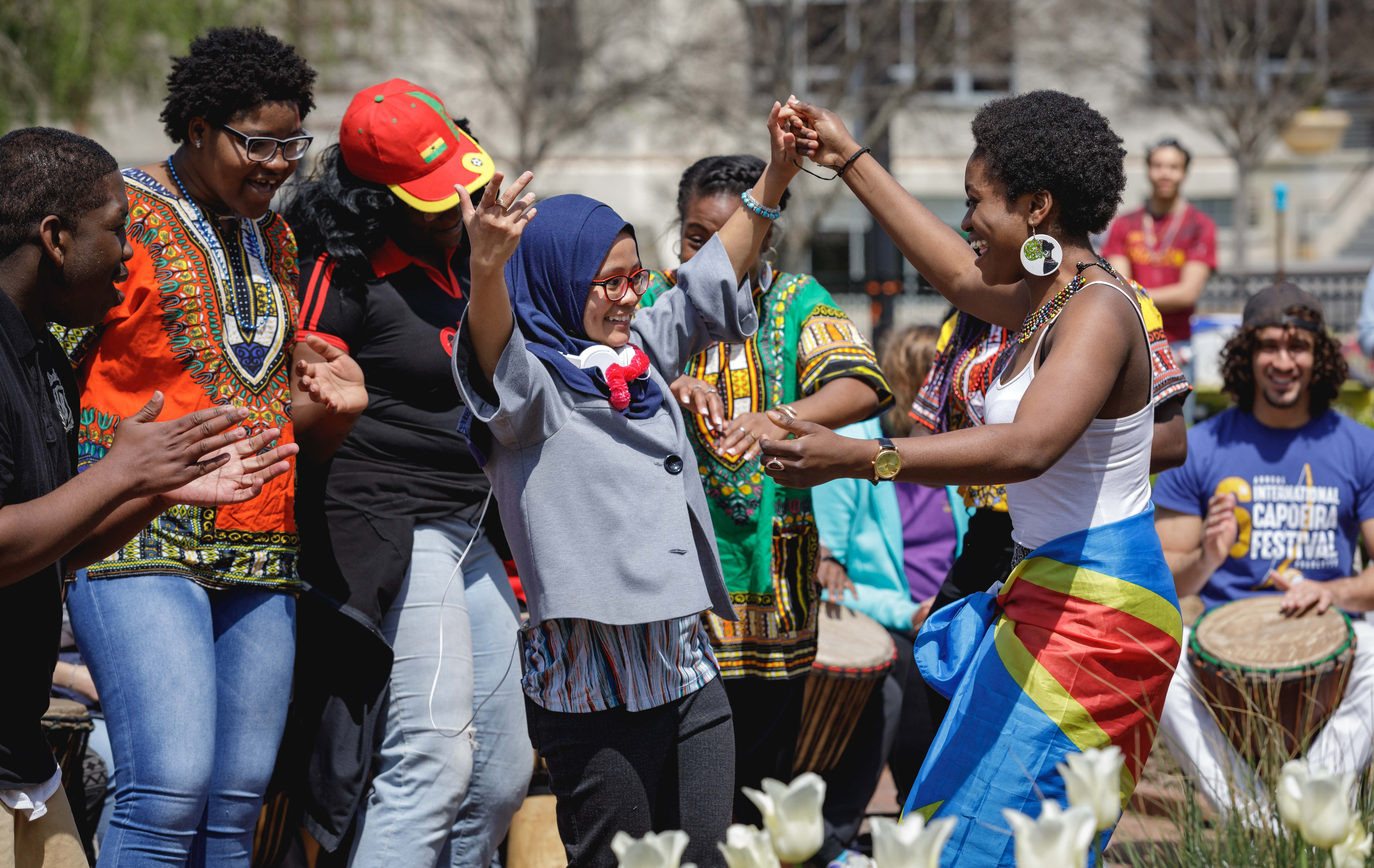 students dancing to drums at festival