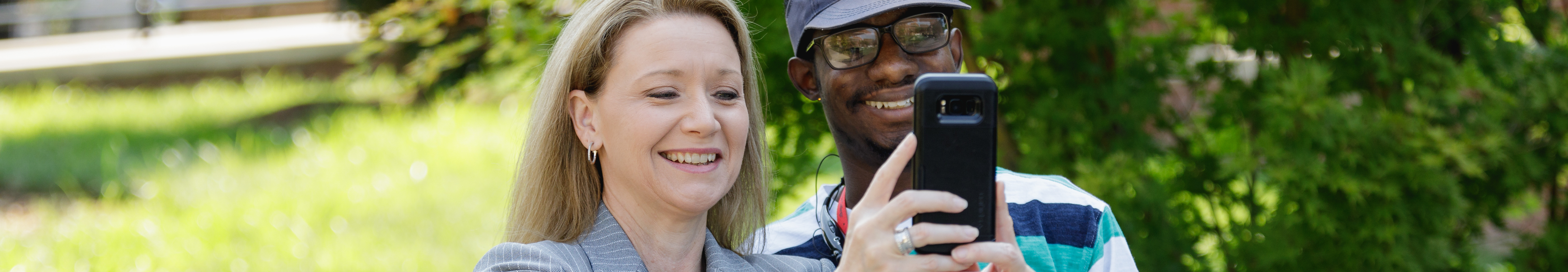 Dr. Deitemeyer taking selfie with a student