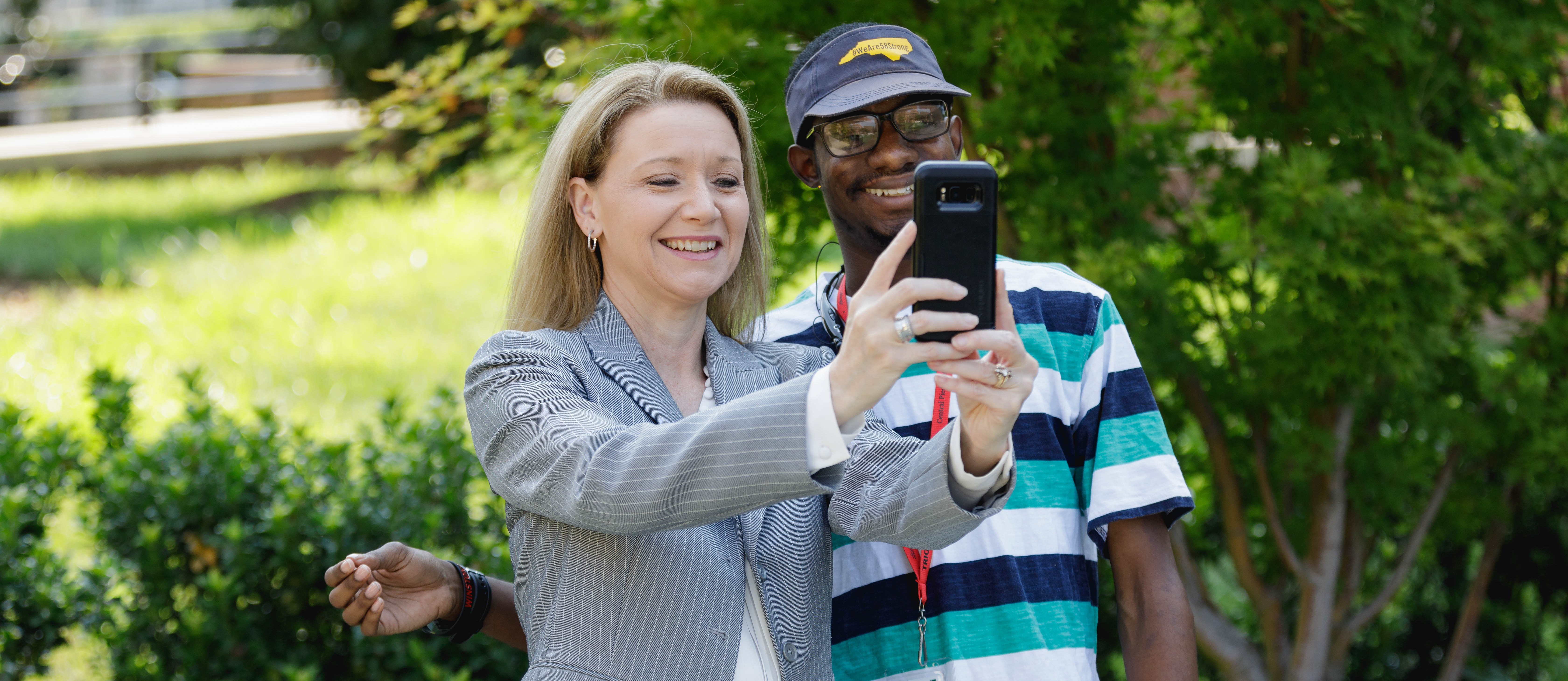 Dr. Deitemeyer taking selfie with a student