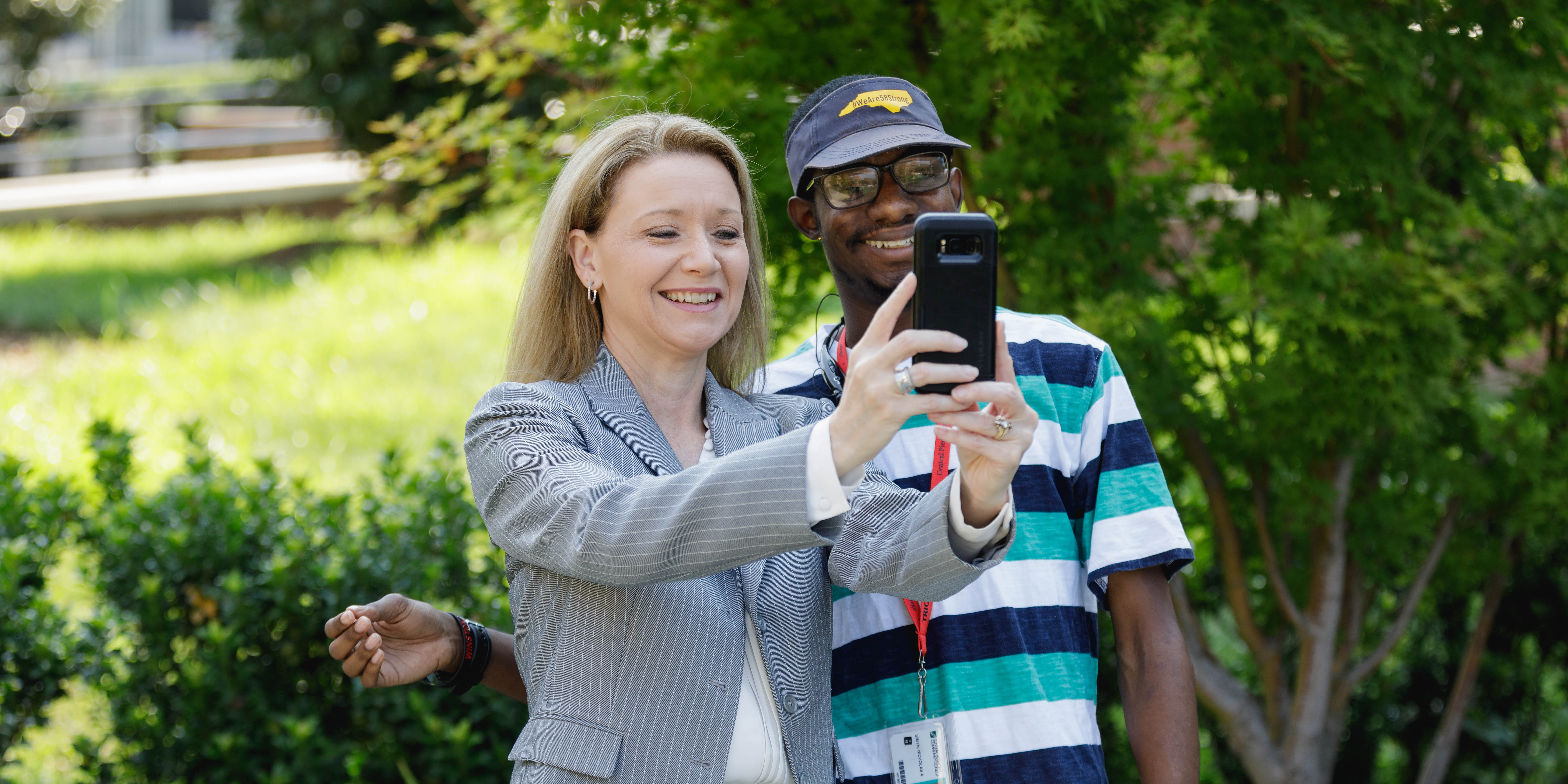 Dr. Deitemeyer taking selfie with a student