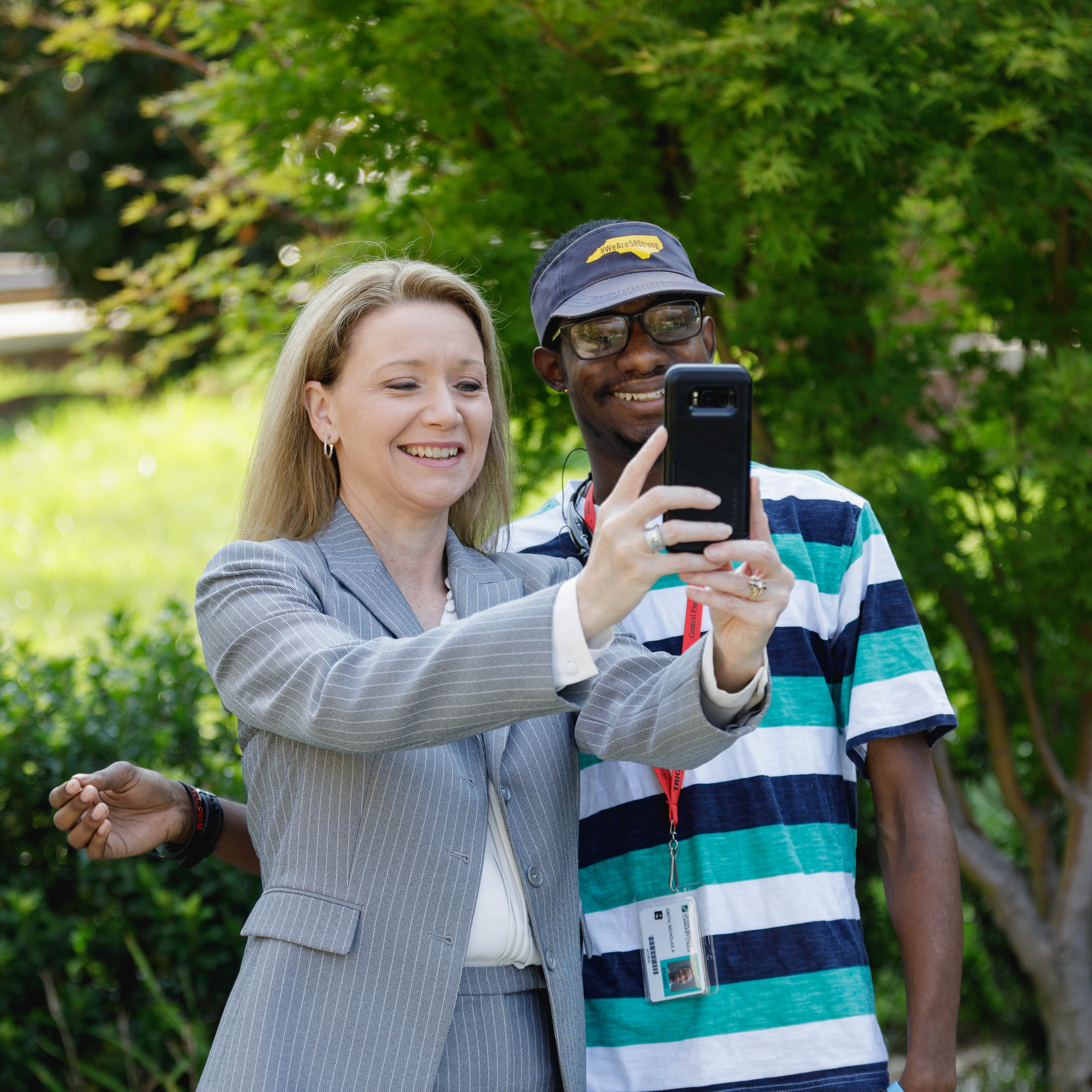 Dr. Deitemeyer taking selfie with a student