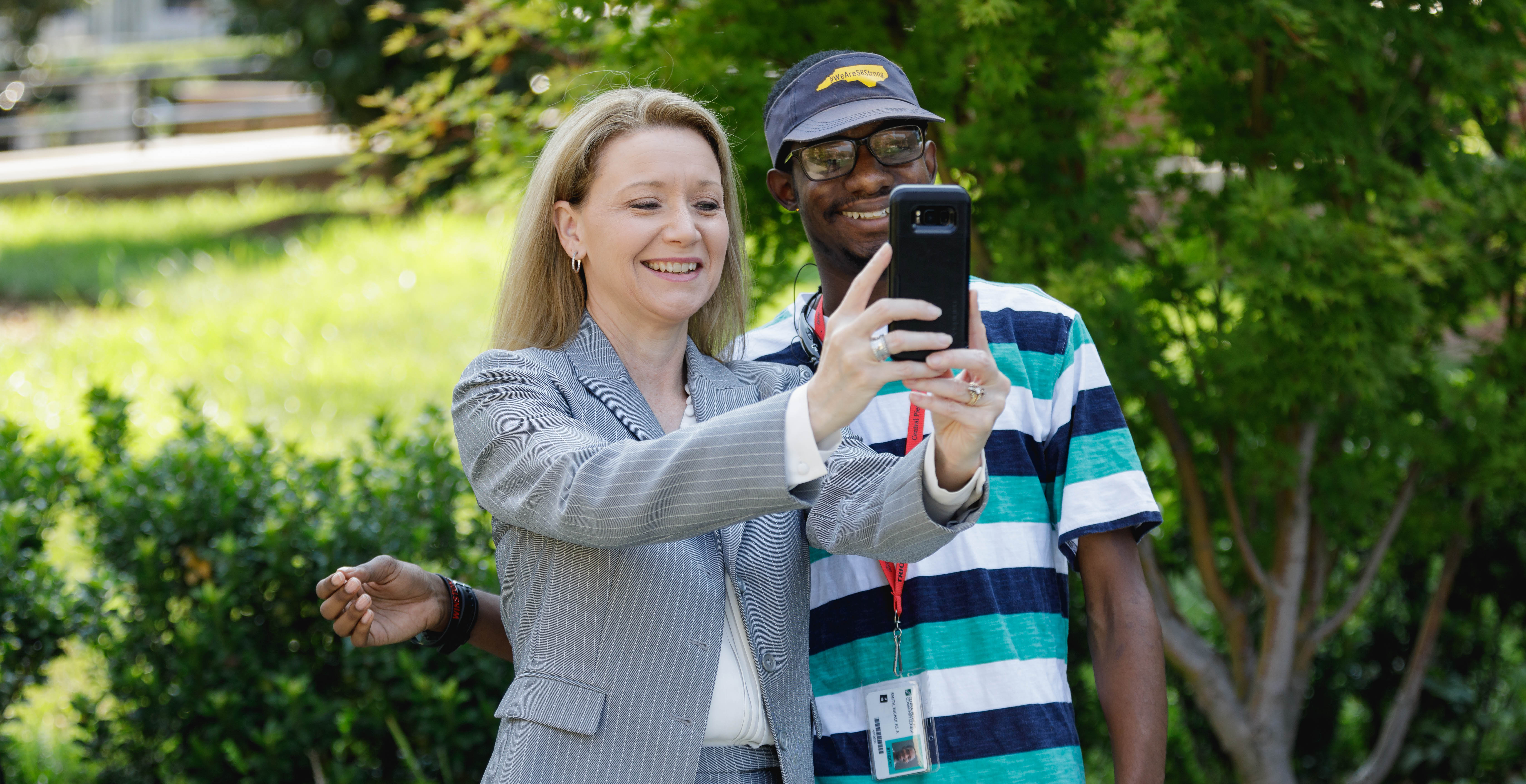 Dr. Deitemeyer taking selfie with a student