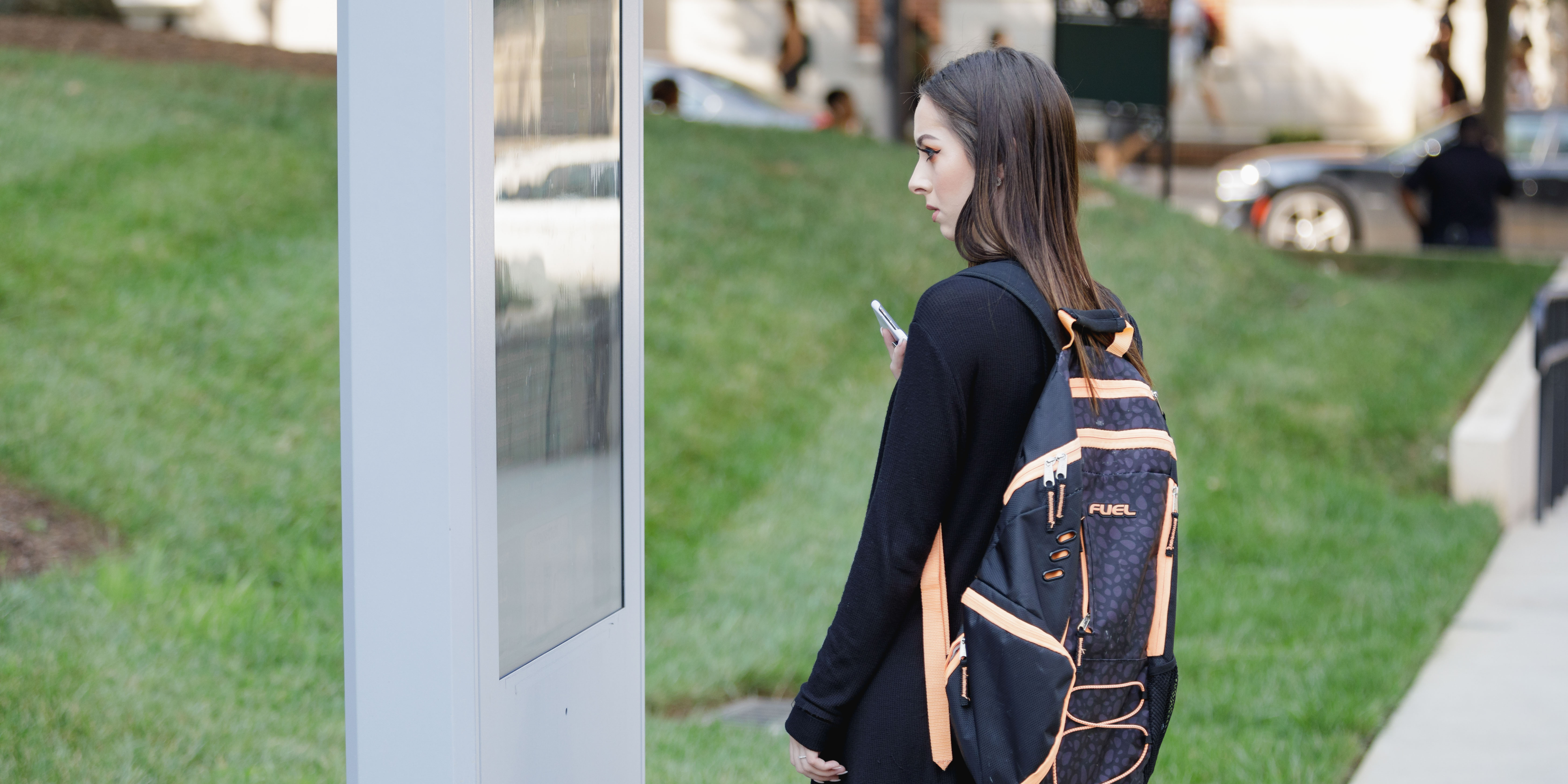 student using map on campus