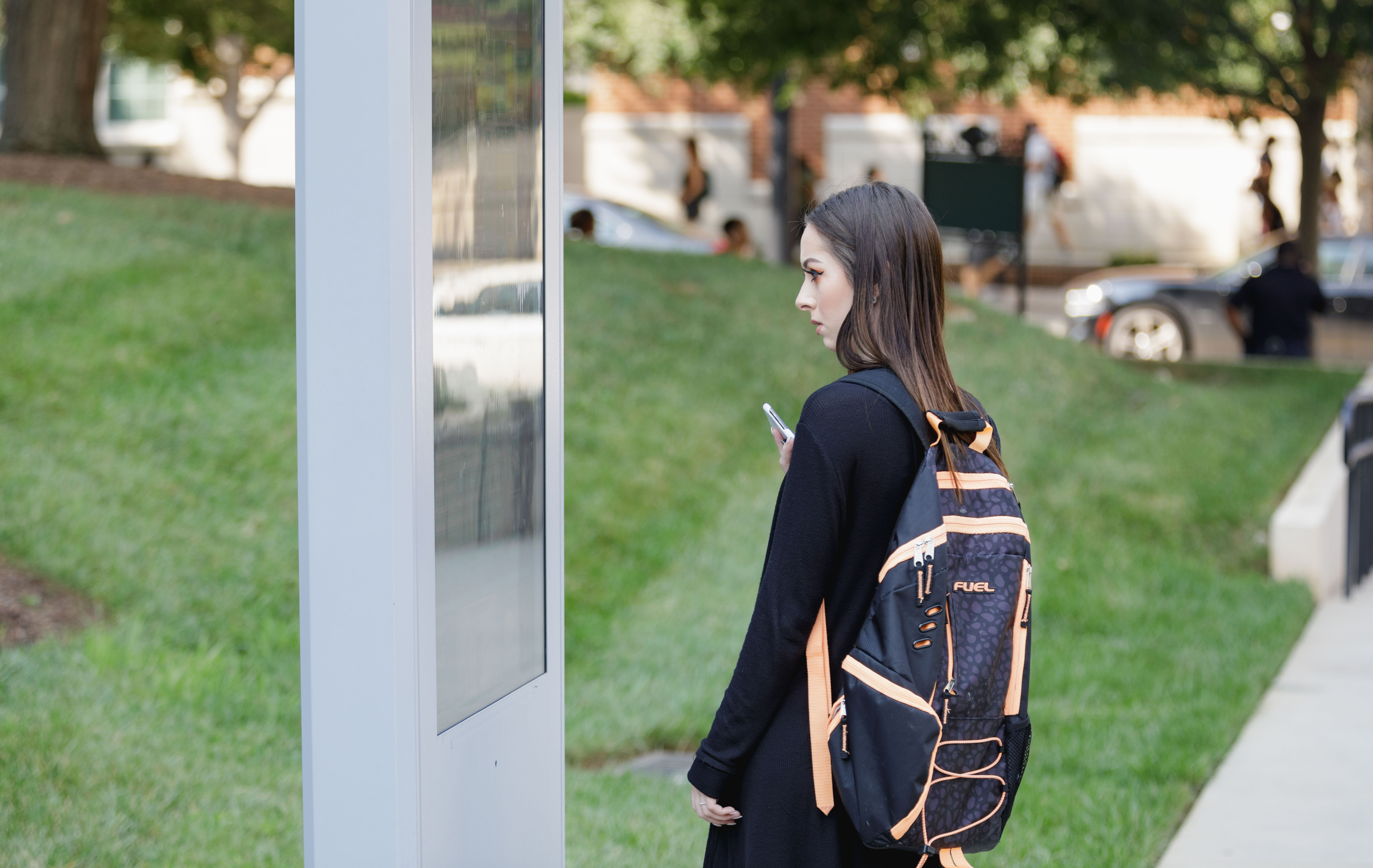 student using map on campus