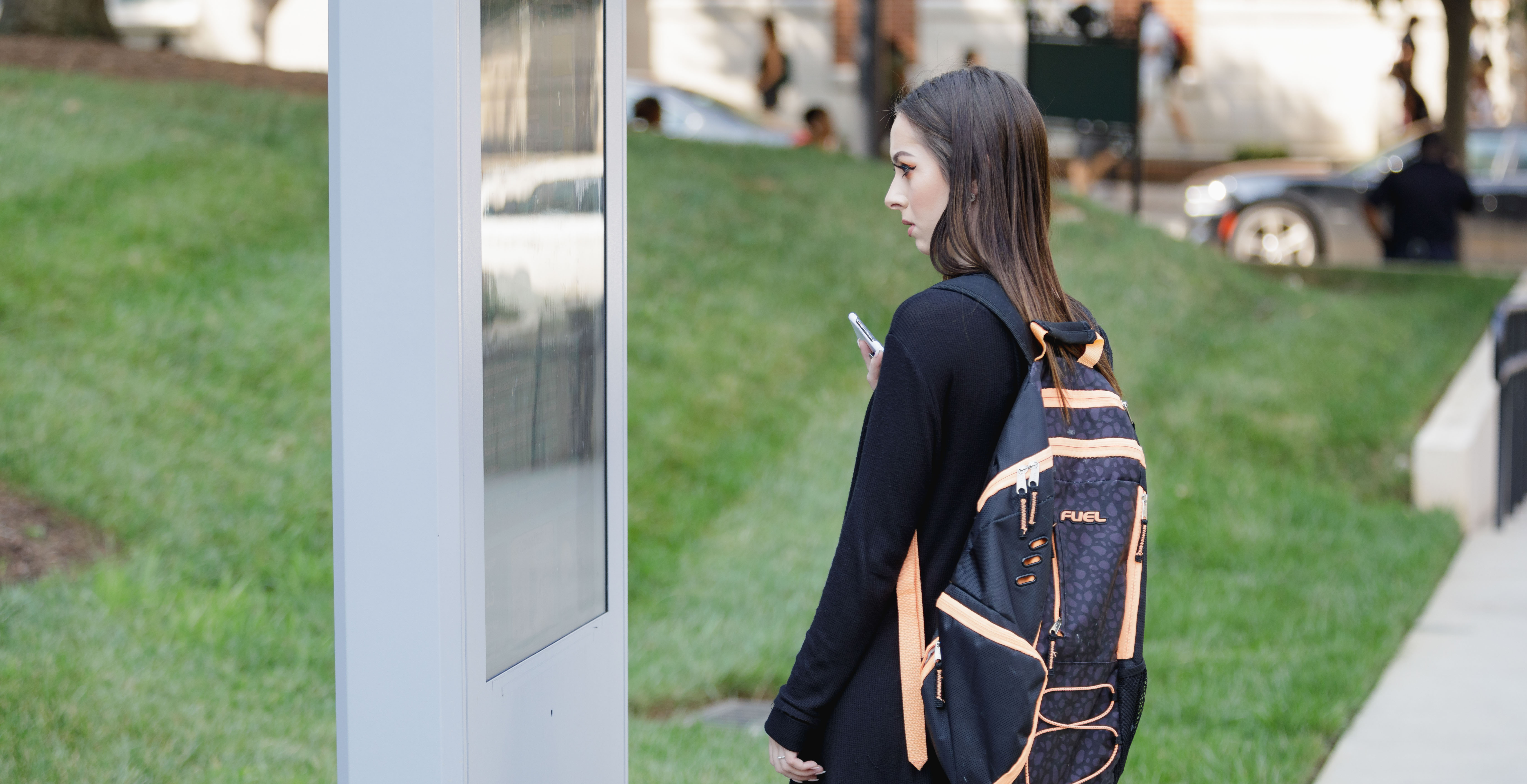 student using map on campus