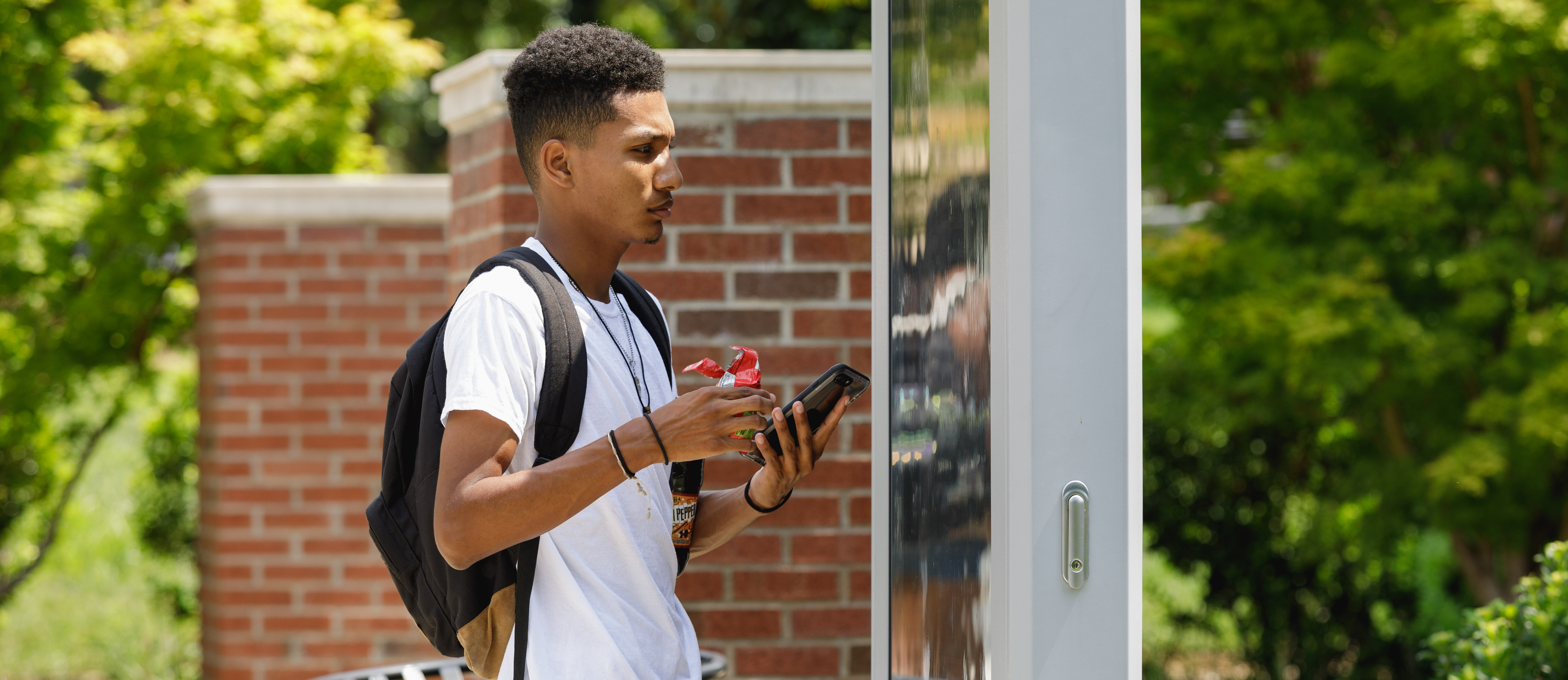 student using map on campus